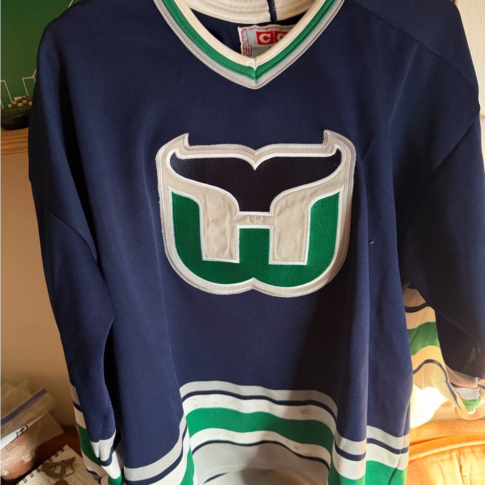 CCM Blue Hockey Jersey with Green and White Accents Hartford Whalers jersey.